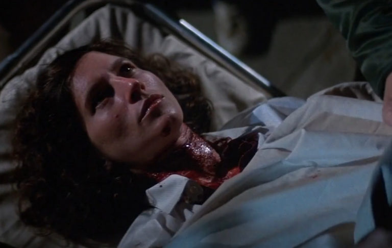 A shot of Annie Brackett (Nancy Kyes) on a stretcher from Halloween II (1981).