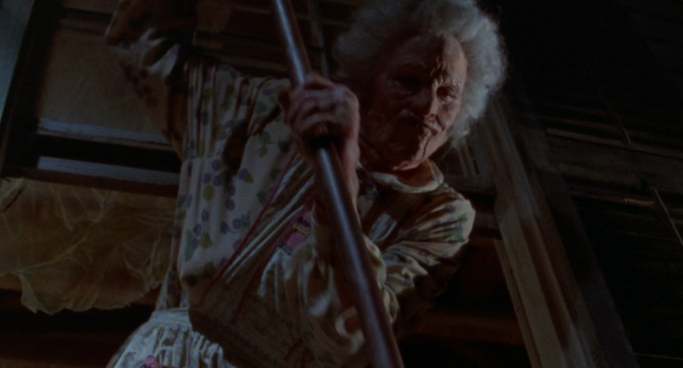 Abigail Leatherbee dropping a pipe out of a second story window in The House on Tombstone Hill (1989).