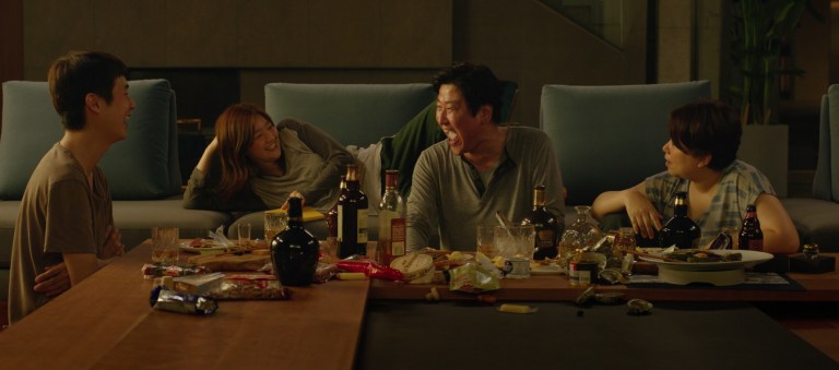 The Kim family enjoys themselves in the Park's luxurious home in Parasite (2019).