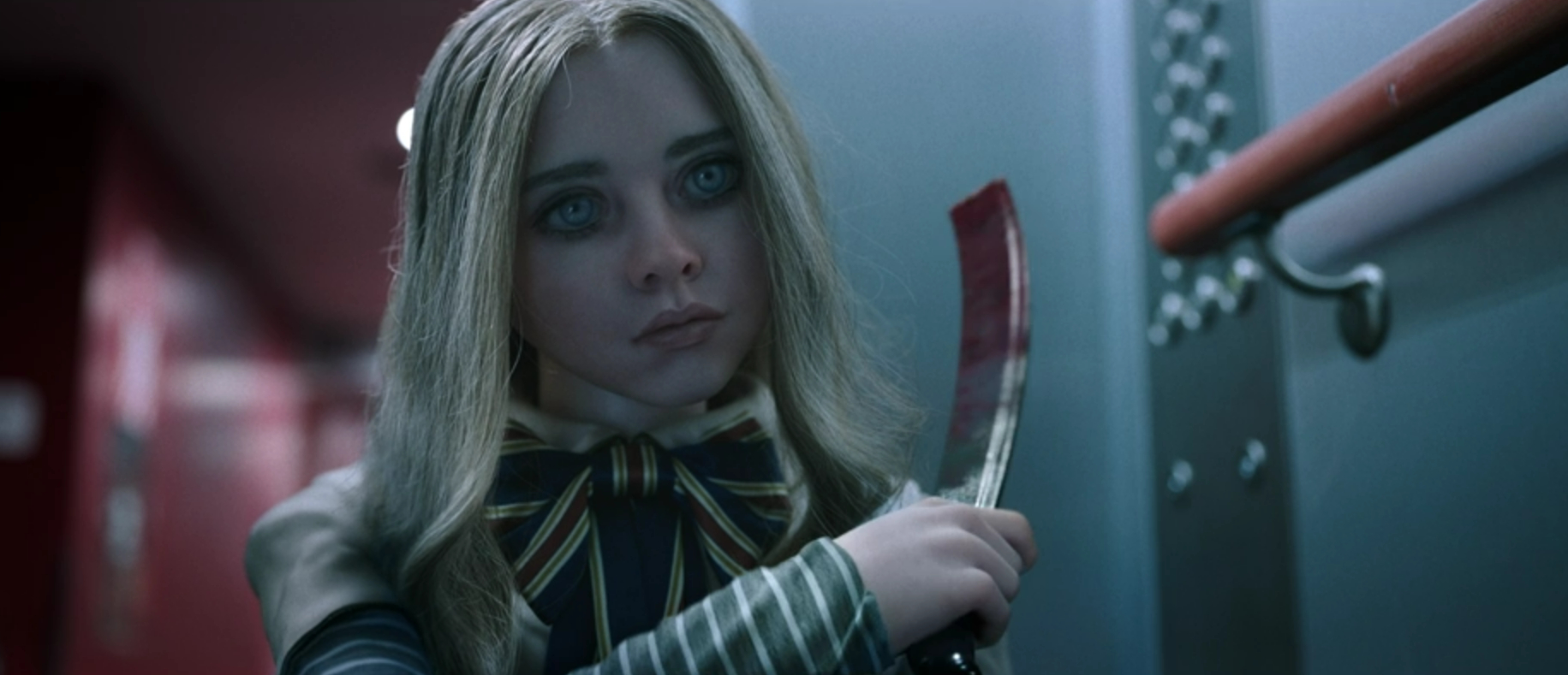M3GAN prepares to swing a blade at Kurt in M3GAN: Unrated (2023).