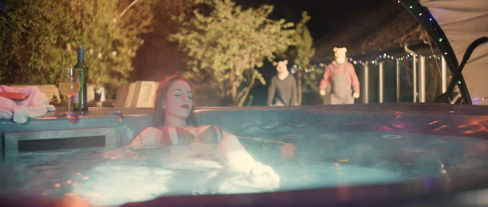 Piglet and Pooh stalk a woman in a hot tub in Winnie the Pooh: Blood and Honey (2023).