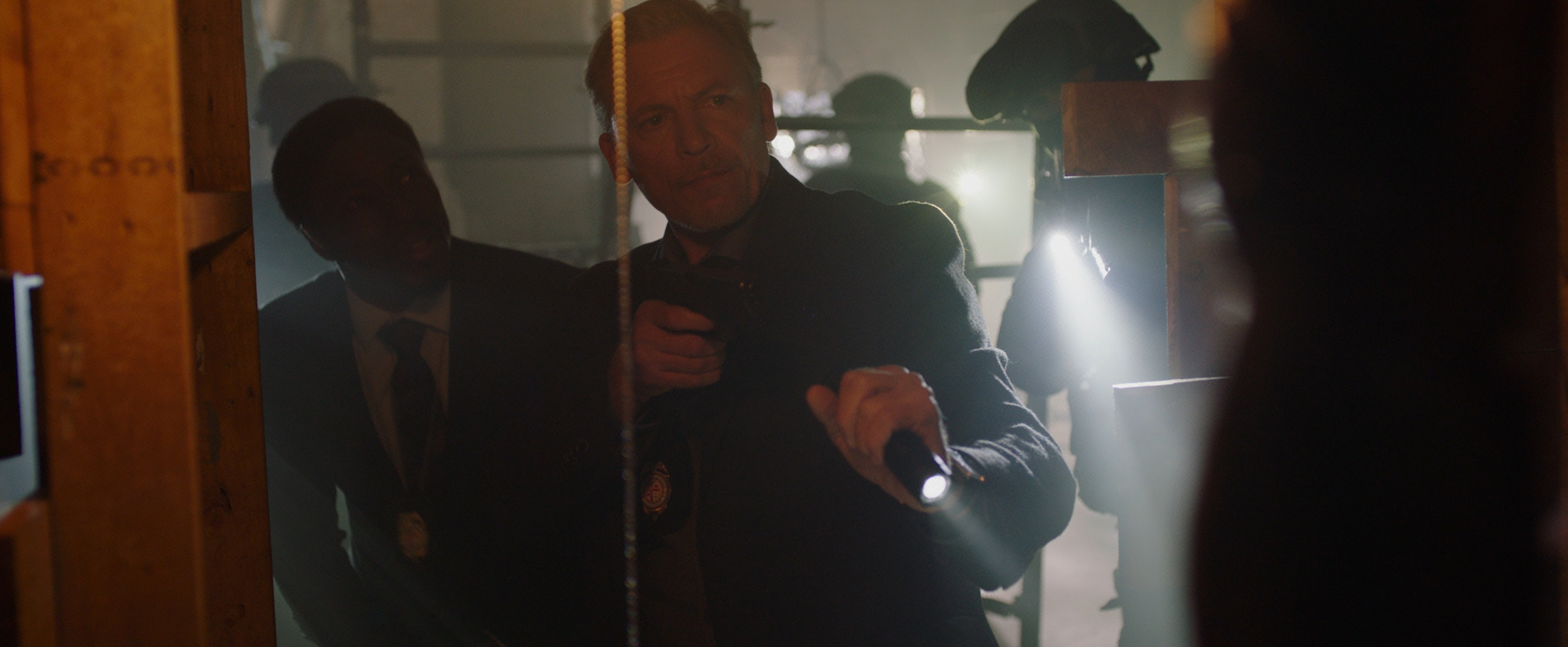 Hunt and Halloran discover a dead body in Eleanor Bonneville's apartment in Jigsaw (2017).