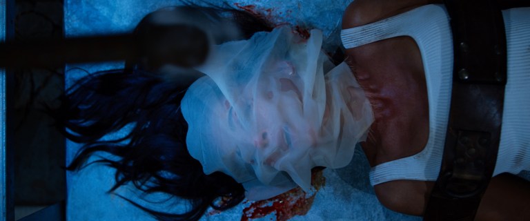 Angie Garza strapped down in Spiral (2021).