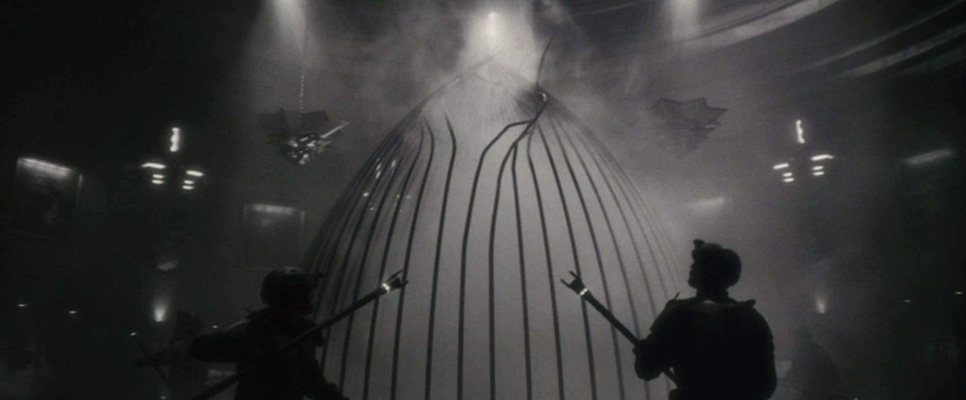 The werewolf escapes his cage and is about to strike.