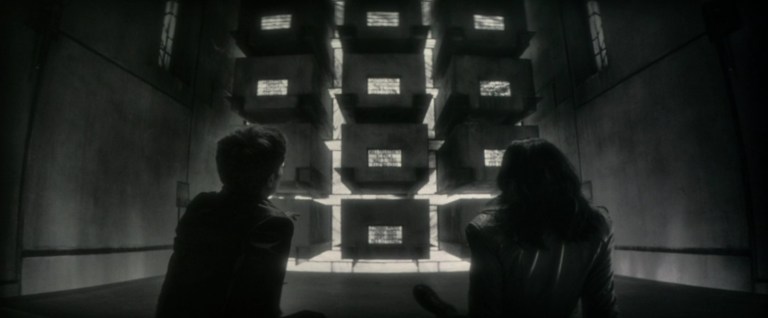 Jack and Elsa sit in a crypt in Werewolf by Night (2022).