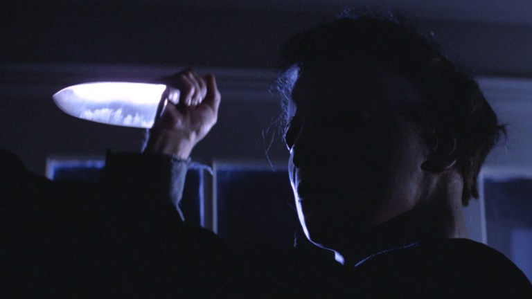 Michael Myers brandishes a kitchen knife in Halloween (1978).