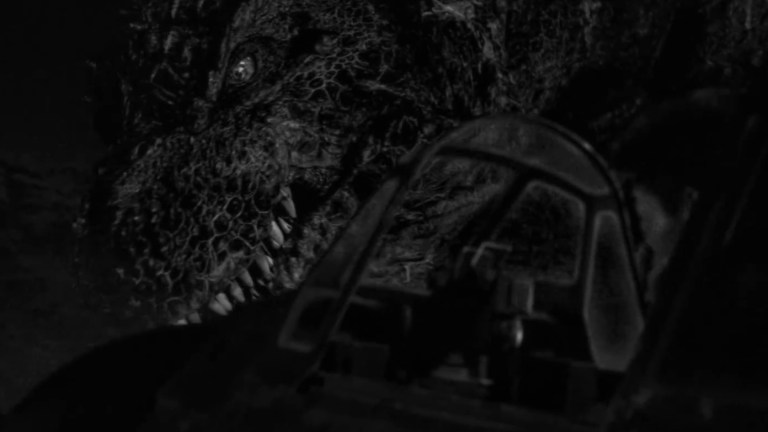 Godzilla's eye can be seen over the nose of a grounded airplane in Godzilla Minus One/Minus Color.