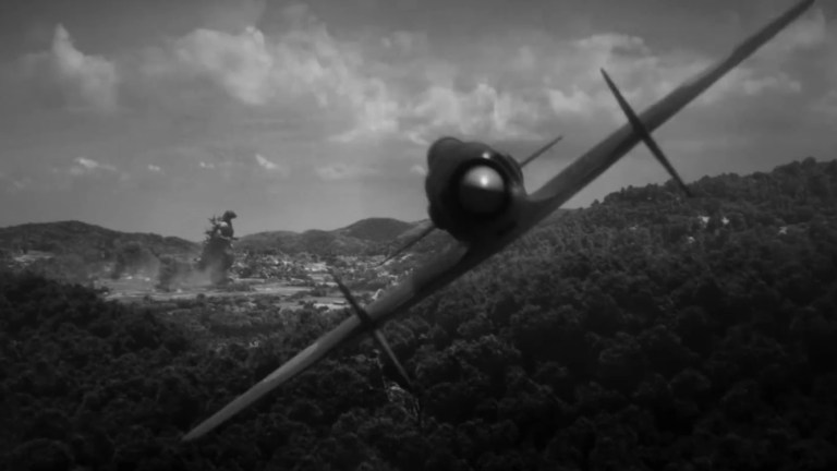 An airplane approaches Godzilla in Godzilla Minus One/Minus Color.
