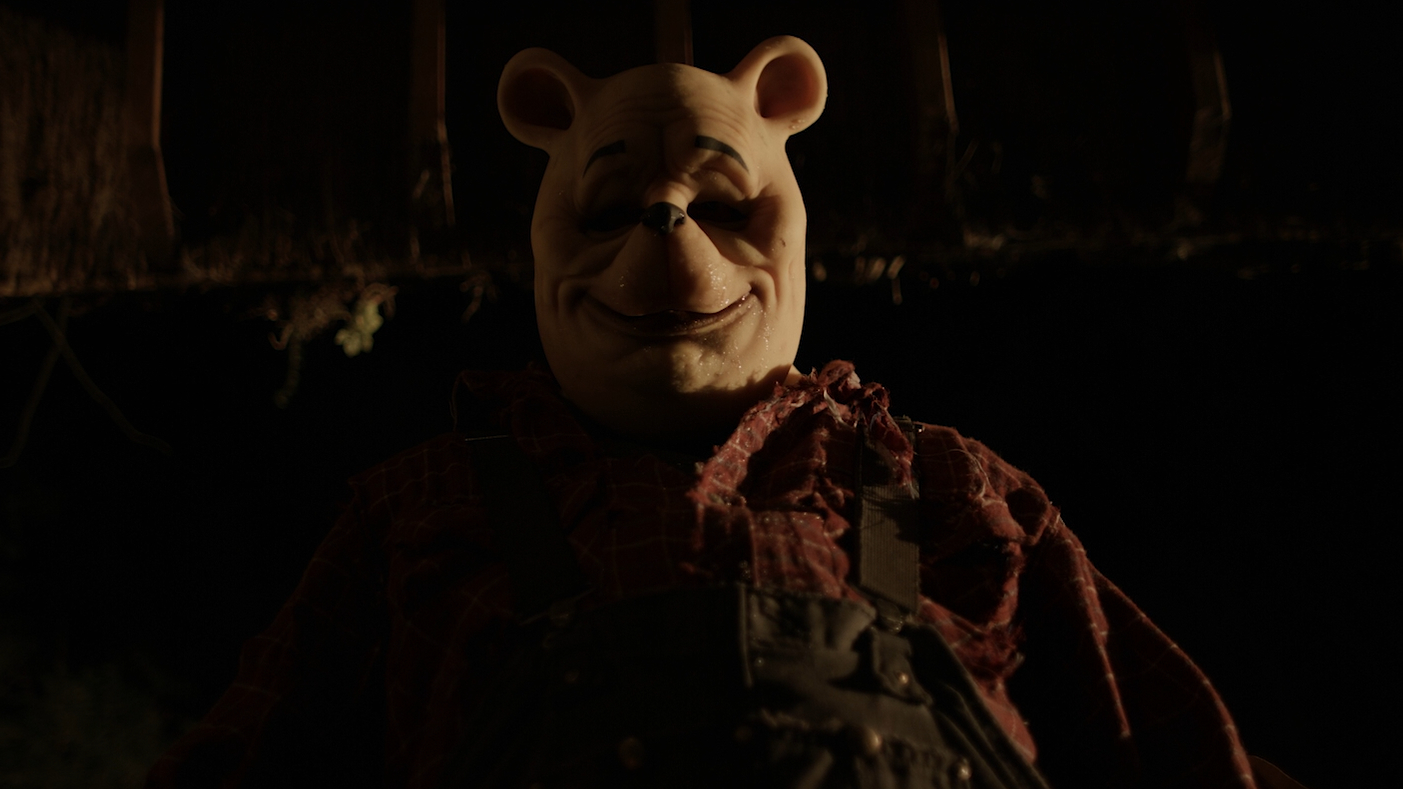 Pooh smiles in Winnie-the-Pooh: Blood and Honey (2023).