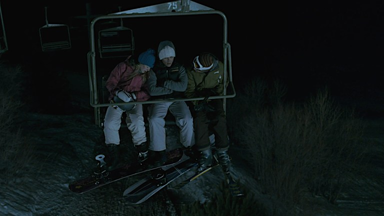 Three people begin to freeze while stuck on a ski lift in Frozen (2010).