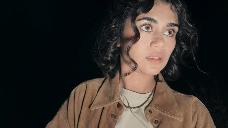 Louise looks forward in the darkness of Dagr (2024).