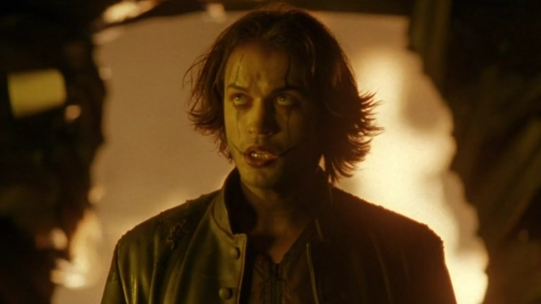 Ashe Corven walks in front of fire in The Crow: City of Angels (1996).
