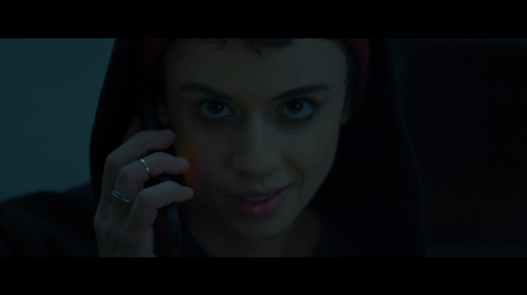Bowie smiles as she talks on the phone in Faceless After Dark (2023).