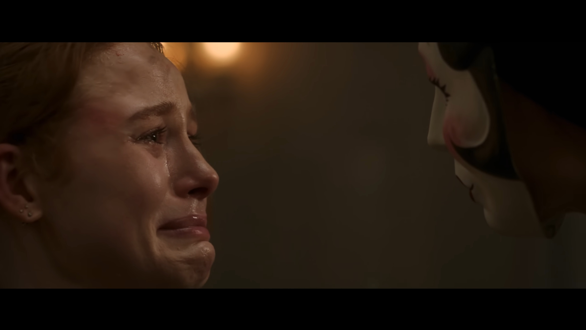 May cries when faced with the Pin-Up Girl in The Strangers: Chapter 1 (2024).