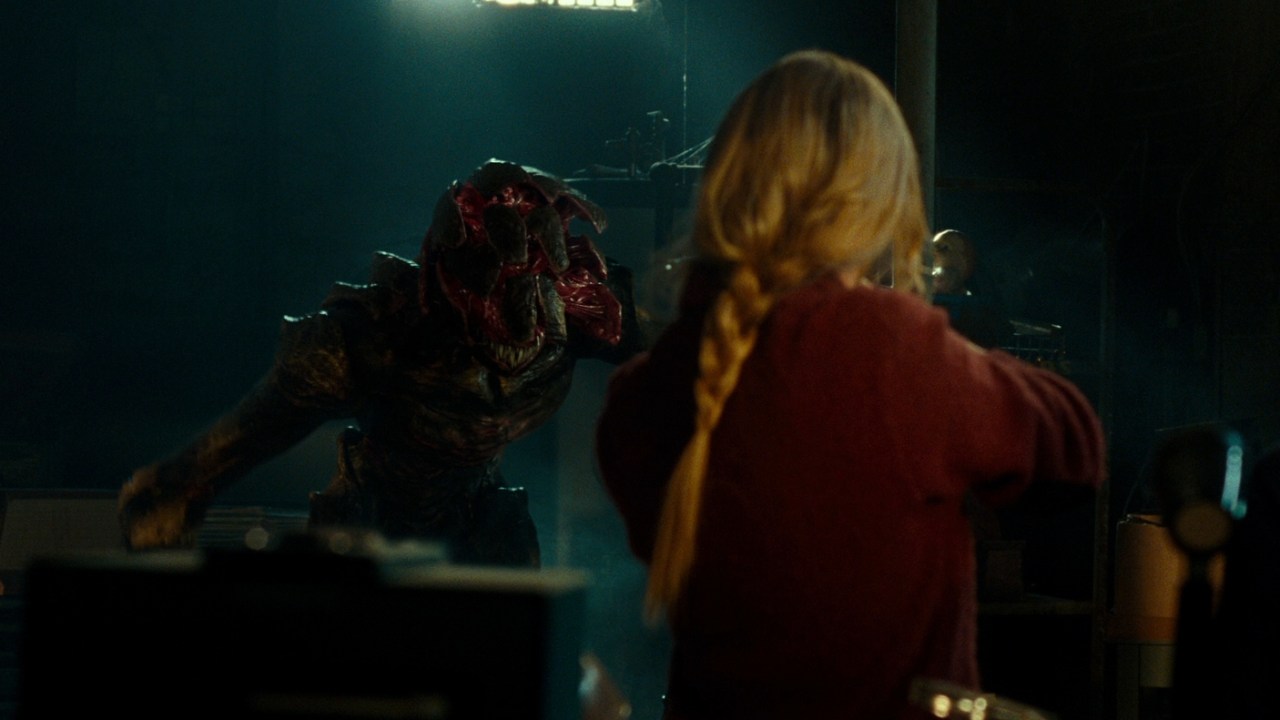 Evelyn faces off with a creature in A Quiet Place (2018).