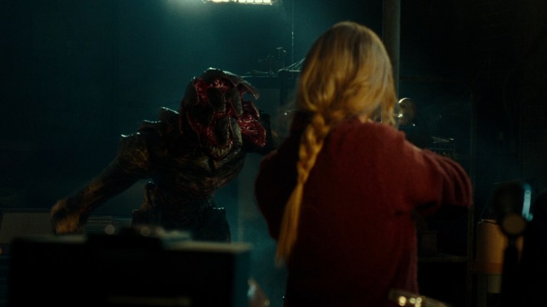Evelyn faces off with a creature in A Quiet Place (2018).