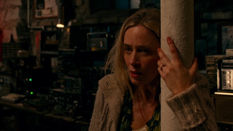 Evelyn braces herself against a post in A Quiet Place (2018).