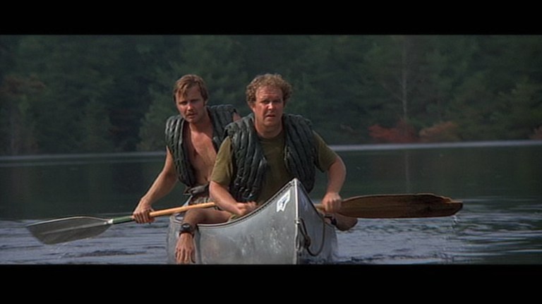 Jon Voight and Ned Beatty row a canoe in Deliverance (1972).