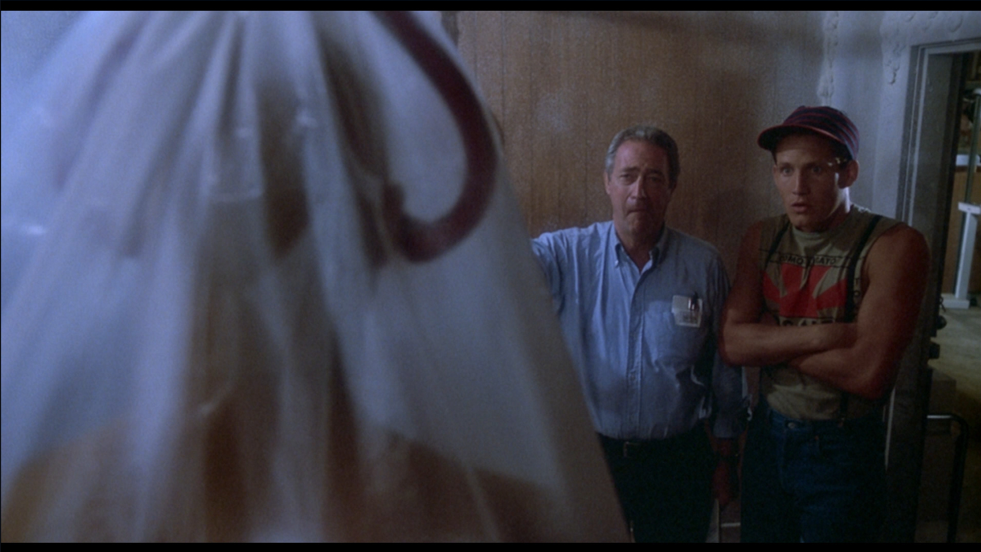 Frank and Freddy look at a frozen corpse in The Return of the Living Dead (1985).