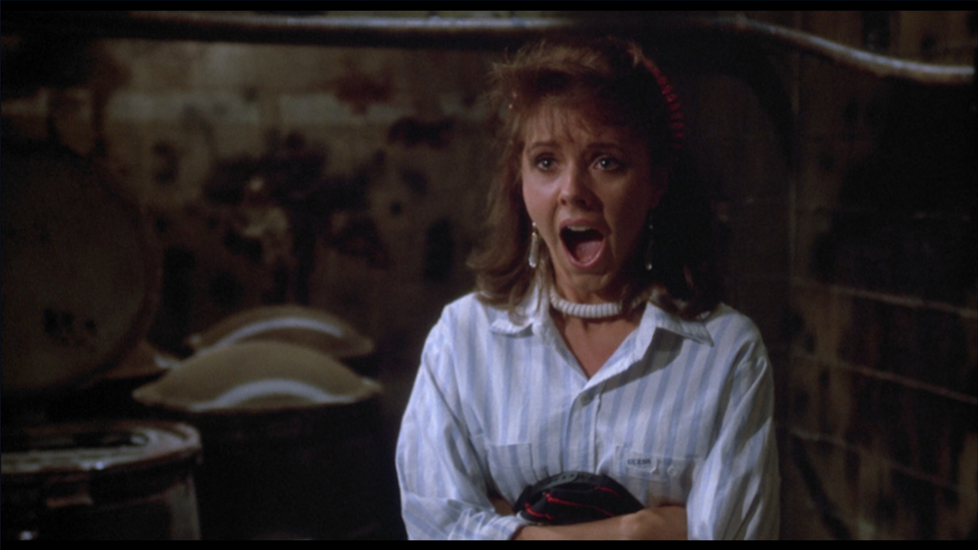 Tina screams in terror in The Return of the Living Dead (1985).