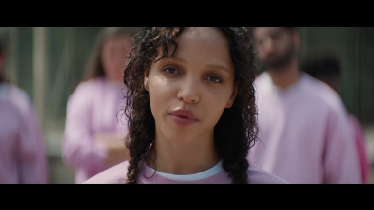 Shelly wears a pink sweatshirt in The Crow (2024).