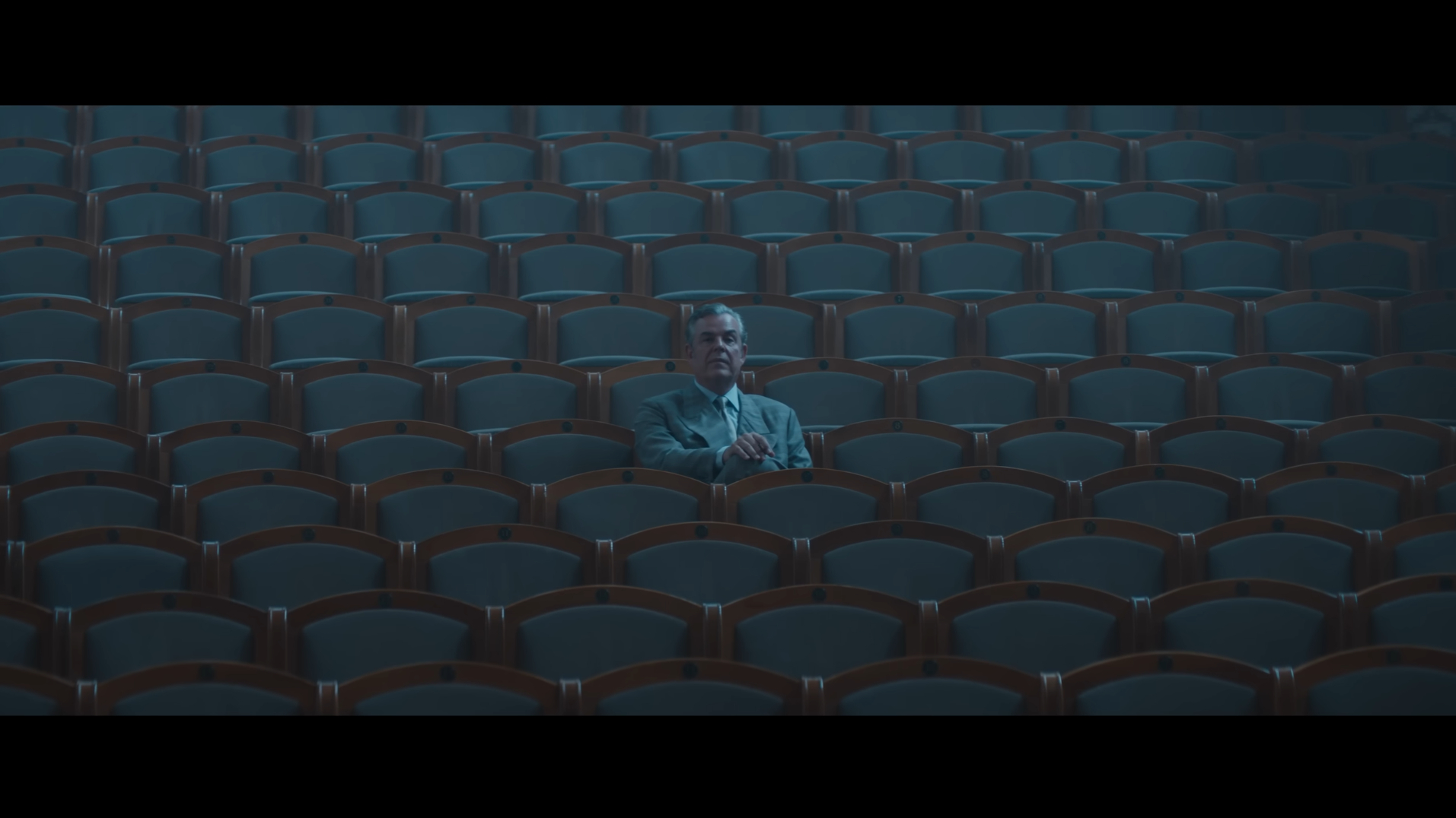 Roeg sits alone in a theater in The Crow (2024).