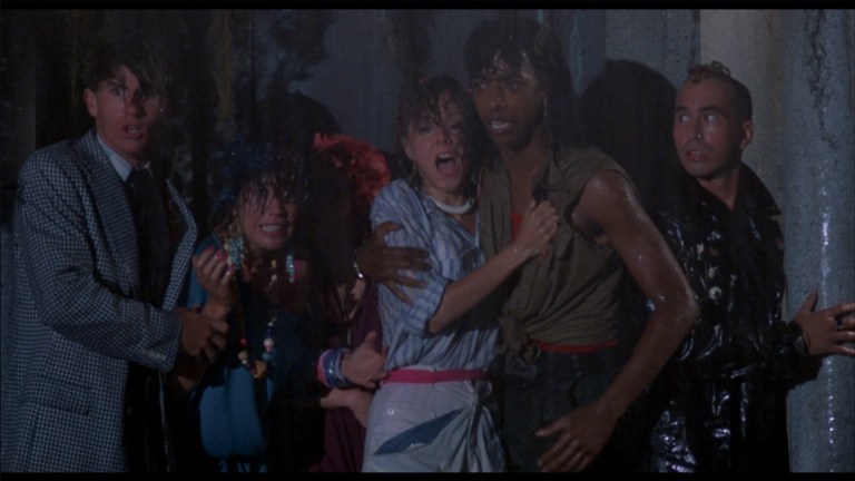 John Philbin, Jewel Shepard, Linnea Quigley, Beverly Randolph, and Miguel Núñez Jr. in The Return of the Living Dead (1985).