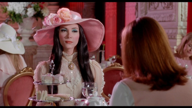 Elaine looks at Trish while having tea in The Love Witch (2016).