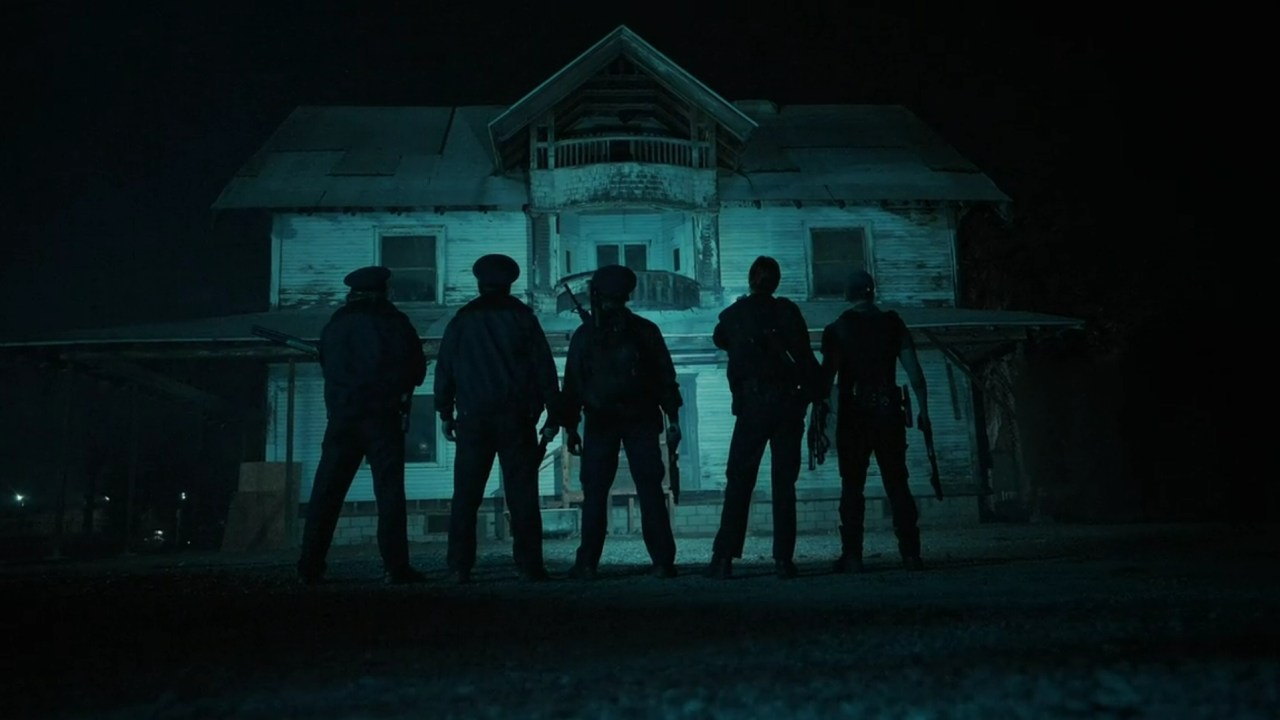 W.A.R.D.E.N. prepares to enter a foreboding house in V/H/S/Beyond (2024).