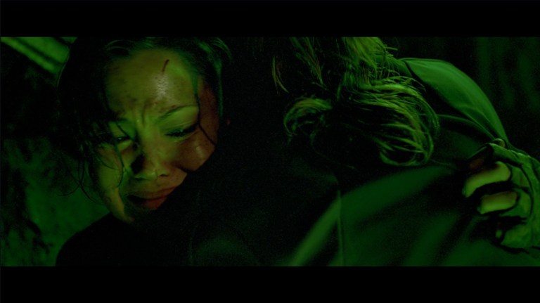 Juno receives a hug from Rebecca in The Descent (2005).