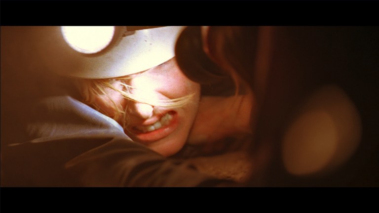 Sarah struggles while being stuck in a tunnel in The Descent (2005).