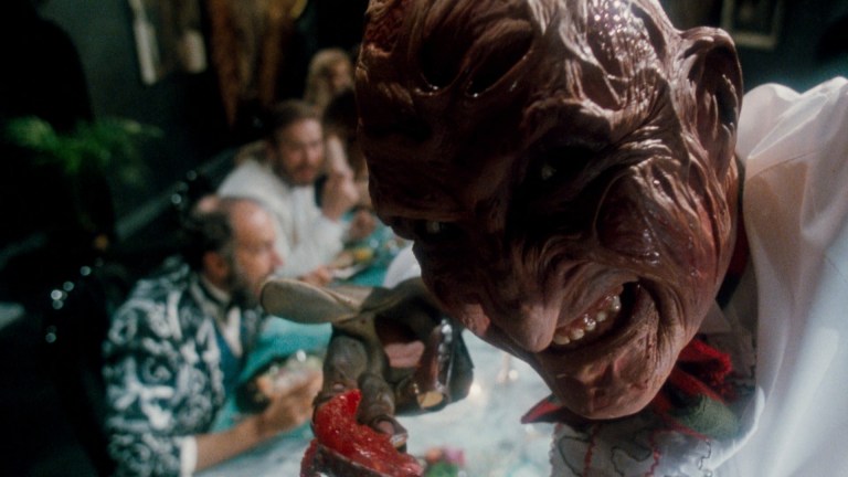 Freddy smiles as he prepares to force-feed Greta in A Nightmare on Elm Street 5: The Dream Child (1989).