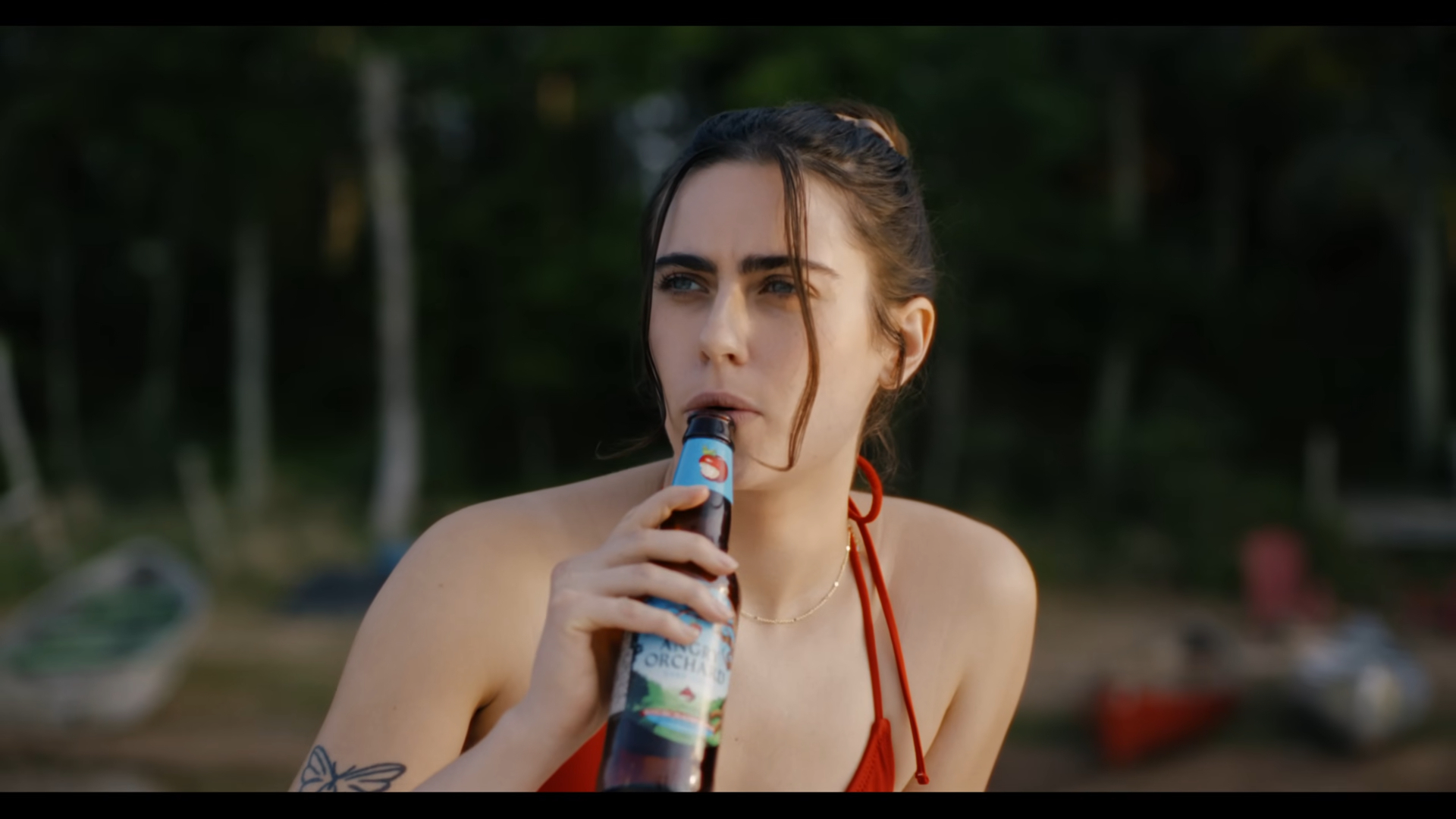 Eve plays with a bottle in Sweet Revenge.