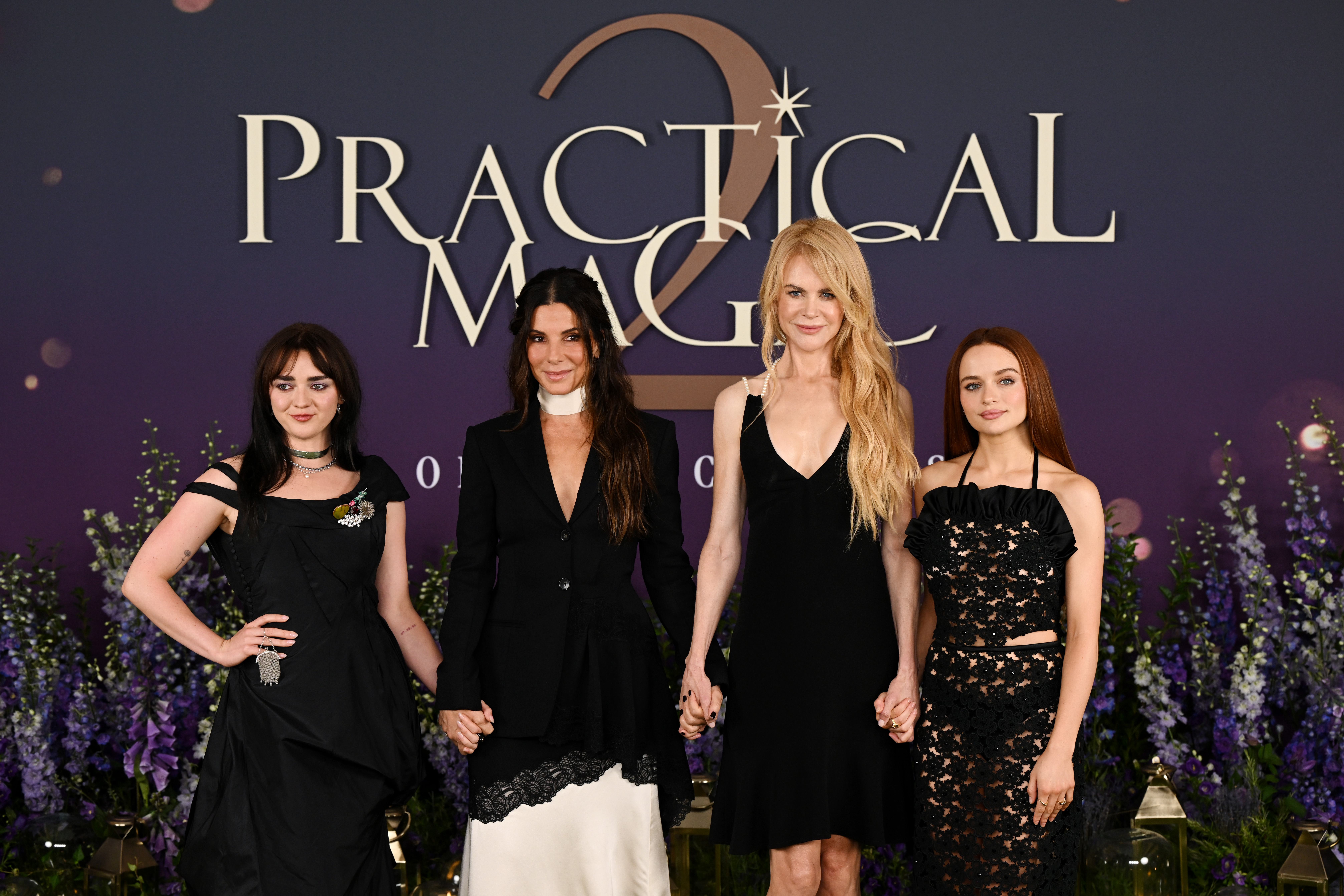 Maisie Williams, Sandra Bullock, Nicole Kidman, and Joey King posing together at the Practical Magic 2 photo call in London