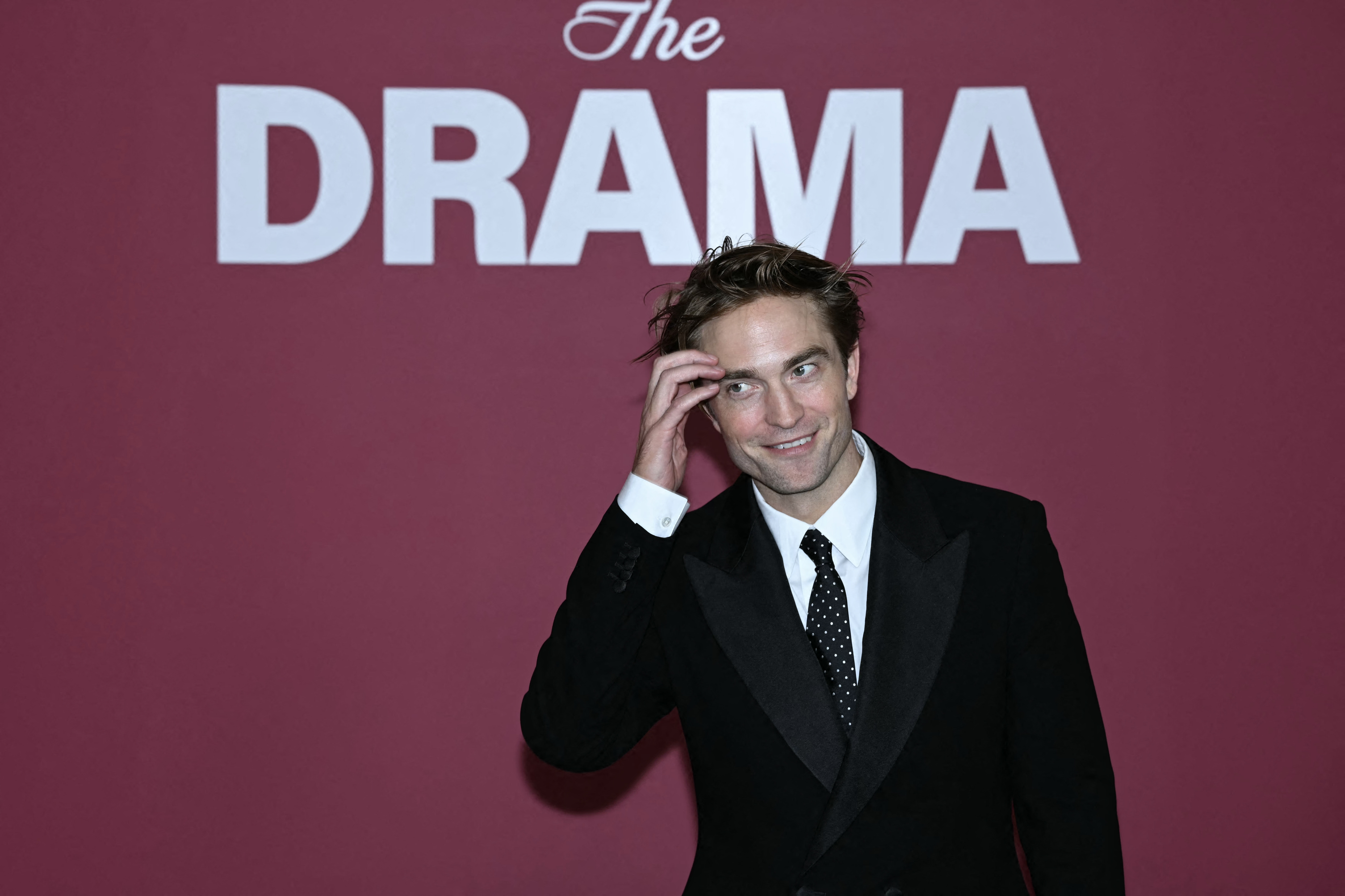 Click to open the image gallery Robert Pattinson posing at a photocall for the film Drama in Paris
